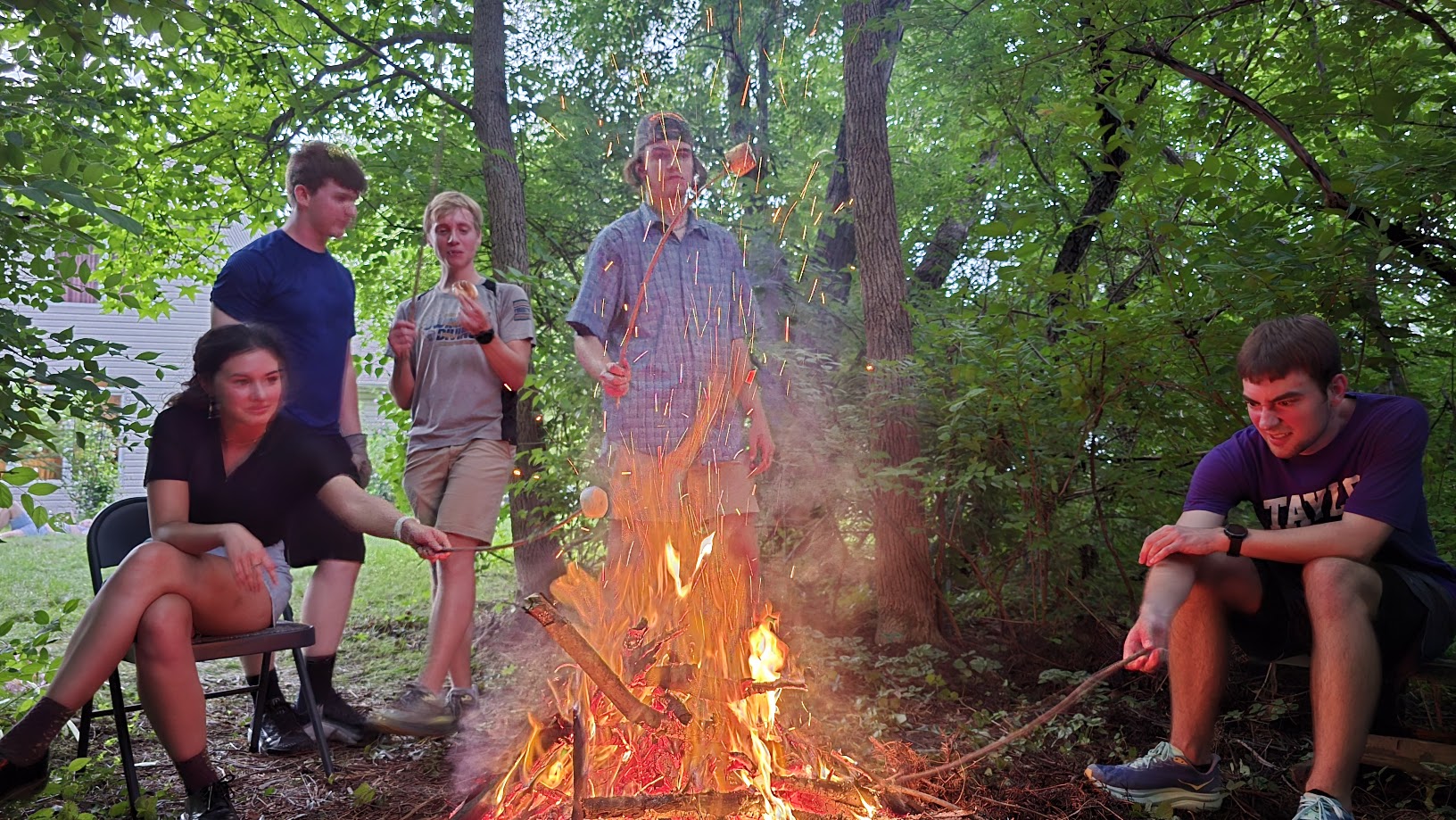 REU students sitting around a campfire